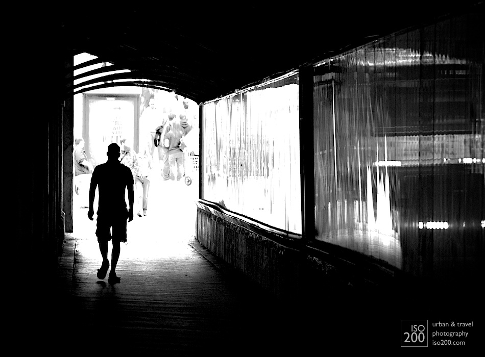 A man walks underneath the railway tracks at the end of Yonge Street, Toronto.
