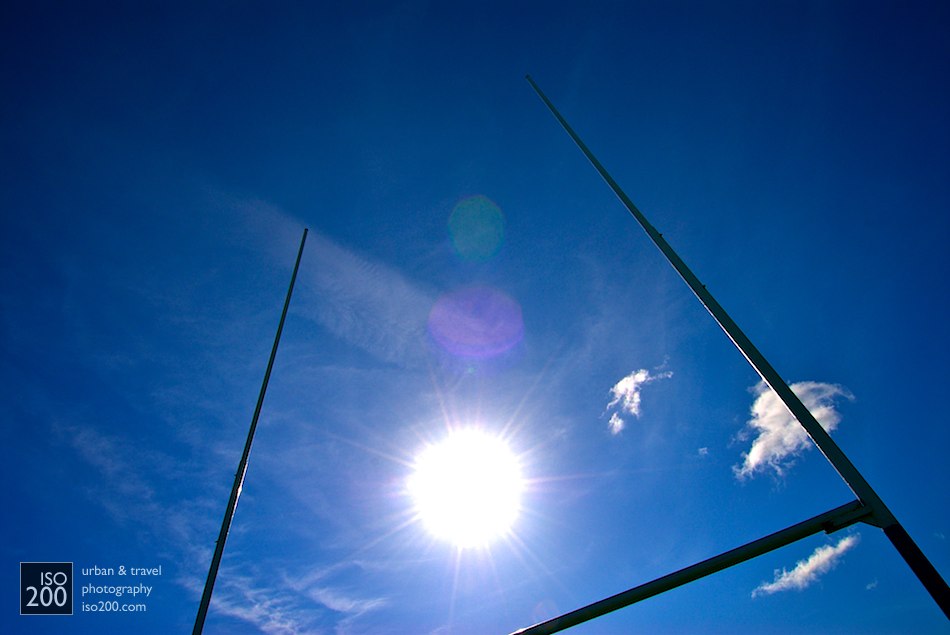 The sun through rugby goalposts on the grounds of Heriot's Rugby Club, Edinburgh.
