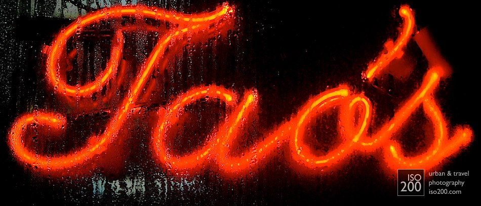 Water drips over Tao's Restaurant neon sign, Manhattan