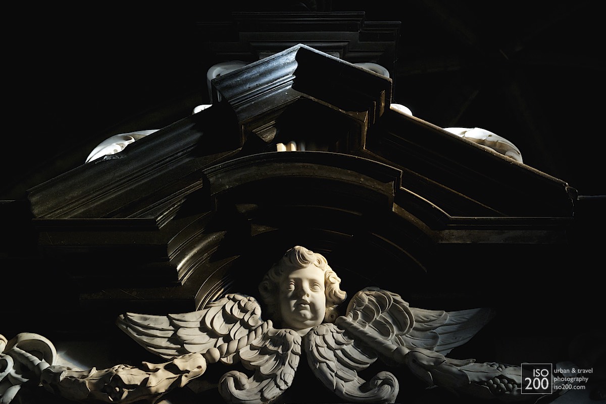 Cherub decoration on a tomb in the ambulatory behind the apse of the Saint Bavo Cathedral (also known as Sint-Baafs Cathedral, or Sint Baafskathedraal in Dutch).