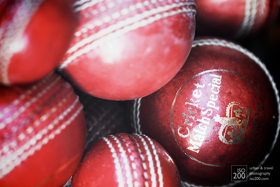 Close up photo of a pile of cricket balls in the shop window of an antique store, Causewayside, Edinburgh