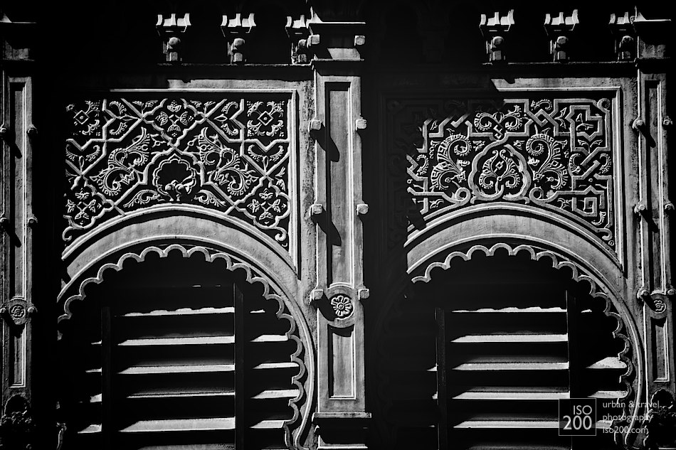 Detail of the windows that are part of the cast iron facade of the Ataranzas, Malaga's famous central market.