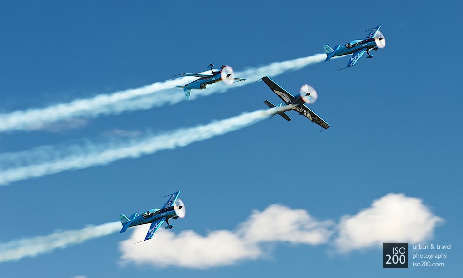 Four Extra EA 300L aeroplanes from the Blades Aerobatic team cavort at the 2010 Leuchars Air Show.